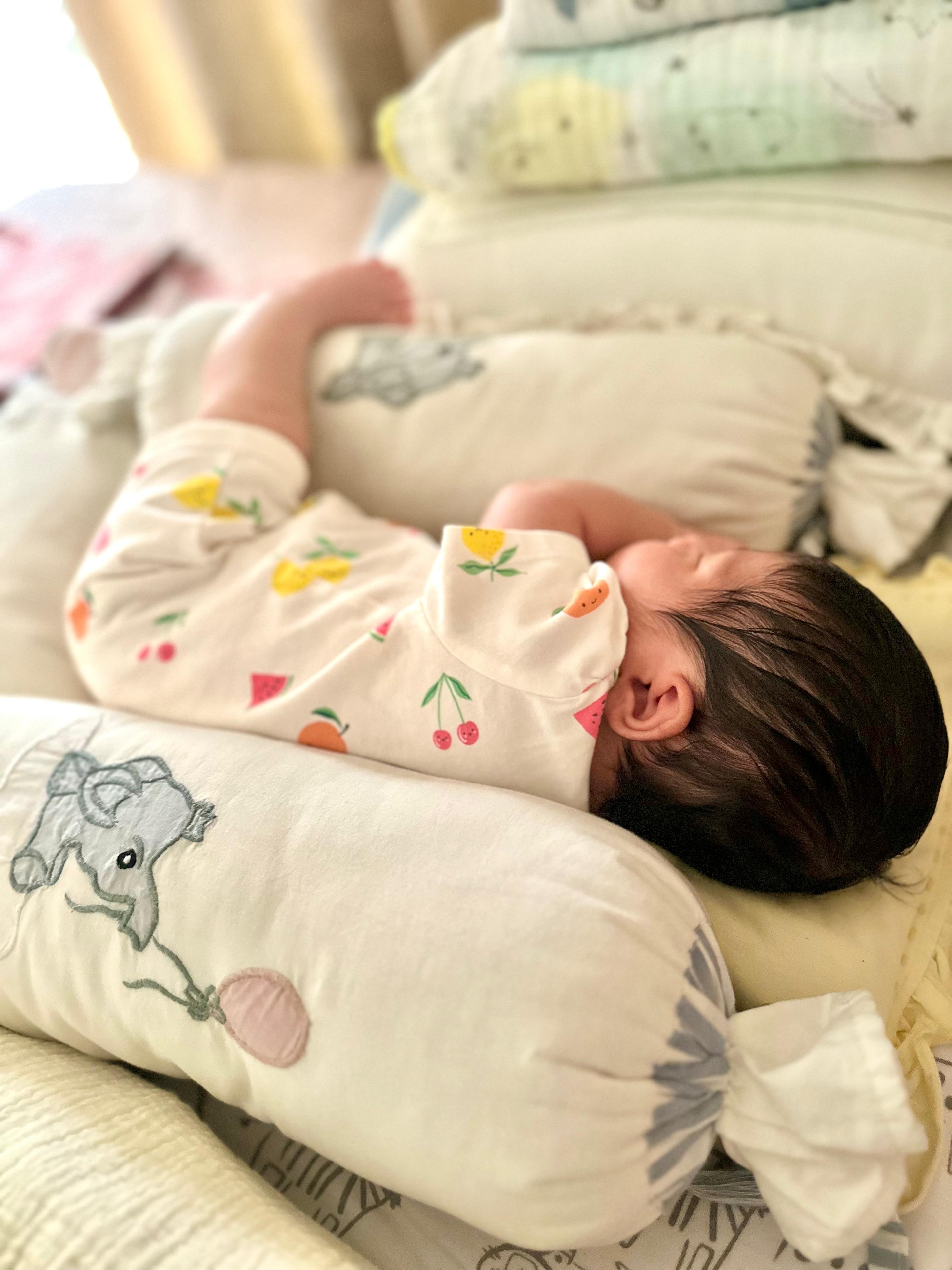 Fruit print onesie. Full head of hair. Completely at peace.